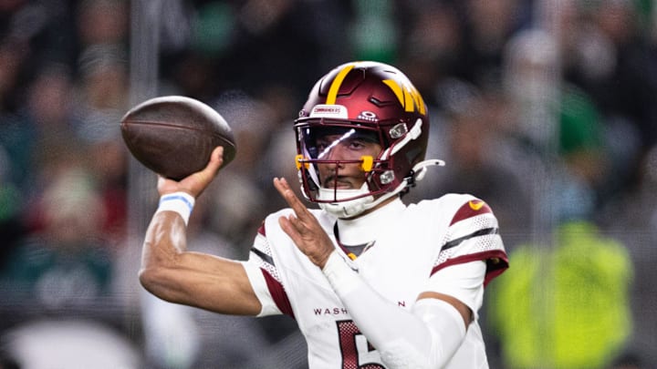 Nov 14, 2024; Philadelphia, Pennsylvania, USA; Washington Commanders quarterback Jayden Daniels (5) throws the ball against the Philadelphia Eagles during the second quarter at Lincoln Financial Field. Mandatory Credit: Bill Streicher-Imagn Images