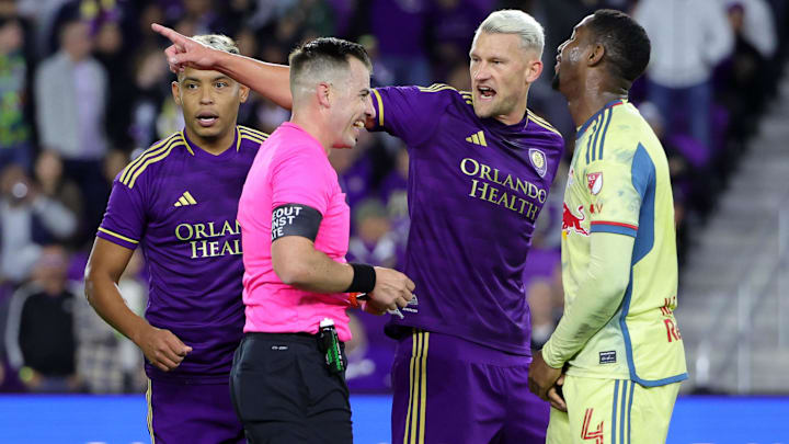 Nov 30, 2024; Orlando, Florida, USA; Orlando City defender Robin Jansson (6) talks with MLS referee Rosendo Mendoza during the second half in the 2024 MLS Cup Eastern Conference Final match at Inter&Co Stadium. Mandatory Credit: Mike Watters-Imagn Images