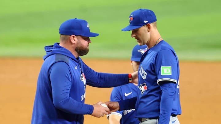 Arlington, Texas, USA; Toronto Blue Jays manager John Schneider (14) removes Toronto Blue Jays starting pitcher Bowden Francis (44) during the sixth inning against the Texas Rangers at Globe Life Field.