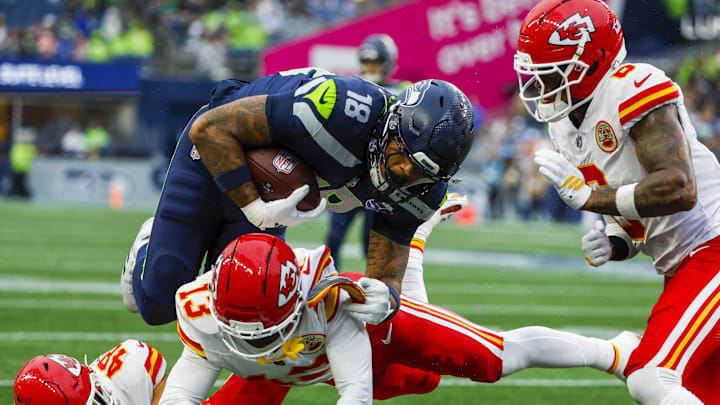 Aug 15, 2025; Seattle, Washington, USA; Seattle Seahawks tight end Elijah Arroyo (18) runs for yards after the catch against Kansas City Chiefs safety Nazeeh Johnson (13), linebacker Cole Christiansen (48) and safety Bryan Cook (6) during the first quarter at Lumen Field. Aug 15, 2025; Seattle, Washington, USA; Seattle Seahawks tight end Elijah Arroyo (18) runs for yards after the catch against Kansas City Chiefs safety Nazeeh Johnson (13), linebacker Cole Christiansen (48) and safety Bryan Cook (6) during the first quarter at Lumen Field.