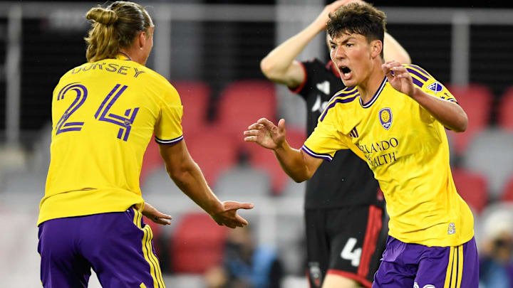 Apr 25, 2026; Washington, District of Columbia, USA; Orlando City SC forward Justin Ellis (22) celebrates with defender Griffin Dorsey (24) after scoring a goal against D.C. United during the second half at Audi Field. Mandatory Credit: Hannah Foslien-Imagn Images