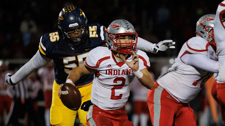 Streetsboro defensive lineman Arthur Scott III closes in on Northwest quarterback Chase Badger during a second-round playoff game Friday, Nov. 8, 2024, in Streetsboro, Ohio. Streetsboro defensive lineman Arthur Scott III closes in on Northwest quarterback Chase Badger during a second-round playoff game Friday, Nov. 8, 2024, in Streetsboro, Ohio.