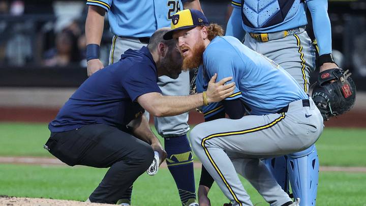 Aug 26, 2026; New York City, New York, USA; Milwaukee Brewers starting pitcher Dustin May (21) is looked on after getting hit by a line drive in the first inning against the New York Mets at Citi Field. Mandatory Credit: Wendell Cruz-Imagn Images Aug 26, 2026; New York City, New York, USA; Milwaukee Brewers starting pitcher Dustin May (21) is looked on after getting hit by a line drive in the first inning against the New York Mets at Citi Field. Mandatory Credit: Wendell Cruz-Imagn Images