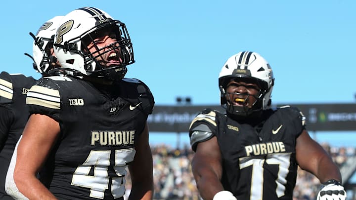 Purdue Boilermakers running back Devin Mockobee celebrates with offensive lineman Mahamane Moussa Purdue Boilermakers running back Devin Mockobee celebrates with offensive lineman Mahamane Moussa