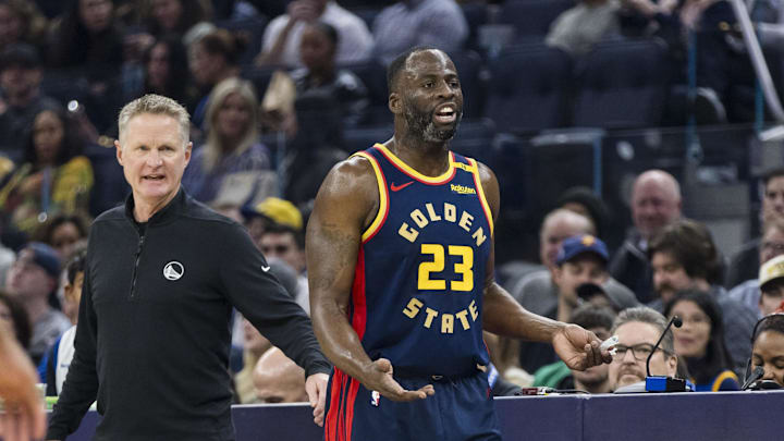 Jan 7, 2025; San Francisco, California, USA; Golden State Warriors forward Draymond Green (23) and head coach Steve Kerr react during the first quarter against the Miami Heat at Chase Center. Mandatory Credit: John Hefti-Imagn Images