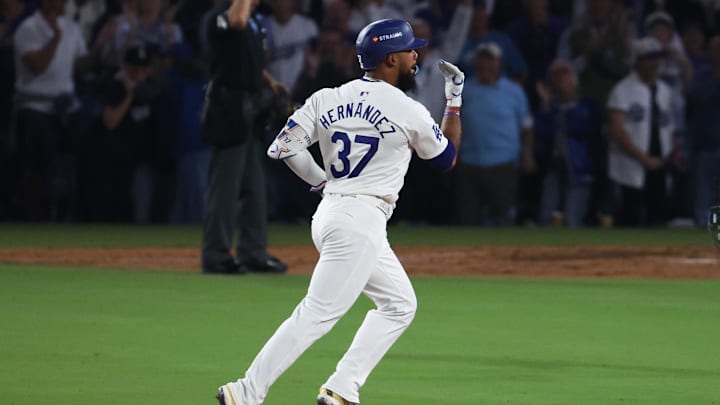 Oct 11, 2024; Los Angeles, California, USA; Los Angeles Dodgers outfielder Teoscar Hernandez (37) runs after hitting a solo home run in the seventh inning against the San Diego Padres during game five of the NLDS for the 2024 MLB Playoffs at Dodger Stadium.