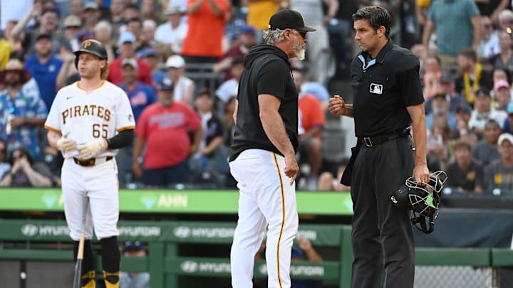 Jul 6, 2024; Pittsburgh, Pennsylvania, USA; Pittsburgh Pirates manager Derek Shelton (17) gets ejected from the game by homeplate umpire John Tumpane (74) after a seventh-inning call on batter Jack Suwinski (65) against the New York Mets at PNC Park. Mandatory Credit: Philip G. Pavely-USA TODAY Sports