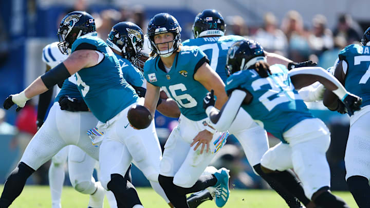 Jacksonville Jaguars quarterback Trevor Lawrence (16) rolls out to scramble during fourth quarter