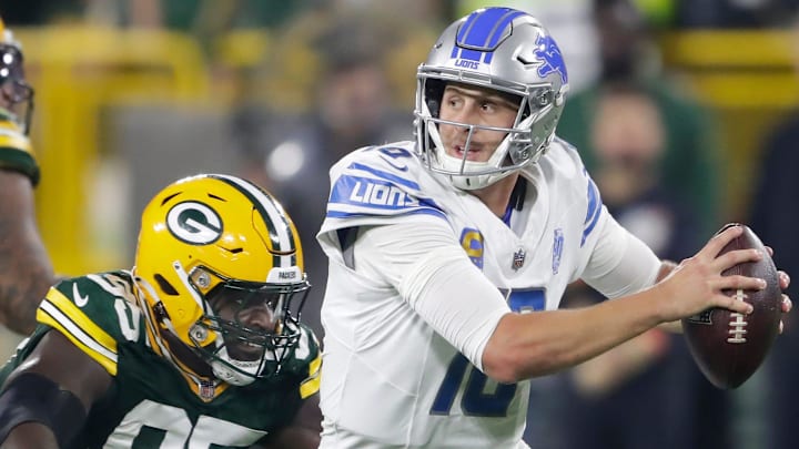 Green Bay Packers defensive tackle Devonte Wyatt (95) chases Detroit Lions quarterback Jared Goff (16) during their football game Thursday, September 28, 2023, at Lambeau Field in Green Bay, Wis. Green Bay Packers defensive tackle Devonte Wyatt (95) chases Detroit Lions quarterback Jared Goff (16) during their football game Thursday, September 28, 2023, at Lambeau Field in Green Bay, Wis.