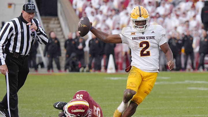 Arizona State Sun Devils quarterback Jeff Sims (2) breaks tackle from Iowa State Cyclones' defensive line Domonique Orange (95) and runs for a first down during the fourth quarter in the Big-12 showdown at jack Trice Stadium on Nov. 1, 2025, in Ames, Iowa. Arizona State Sun Devils quarterback Jeff Sims (2) breaks tackle from Iowa State Cyclones' defensive line Domonique Orange (95) and runs for a first down during the fourth quarter in the Big-12 showdown at jack Trice Stadium on Nov. 1, 2025, in Ames, Iowa.