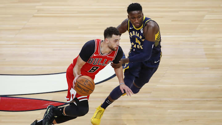 Dec 26, 2020; Chicago, Illinois, USA; Chicago Bulls guard Zach LaVine (8) drives to the basket against Indiana Pacers guard Victor Oladipo (4) during the first half of an NBA game at United Center. Mandatory Credit: Kamil Krzaczynski-Imagn Images