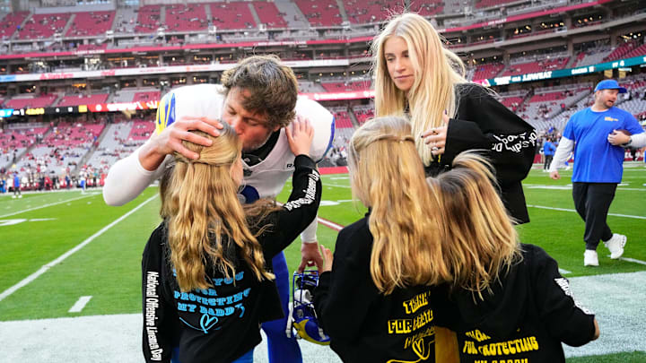 Los Angeles Rams quarterback Matthew Stafford (9) kisses his daughters before playing the Arizona Cardinals at State Farm Stadium on Dec 7, 2025, in Glendale, Ariz.