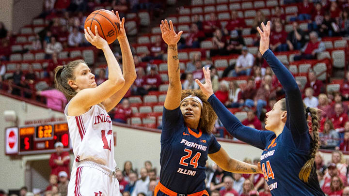 Indiana's Yarden Garzon (12) shoots over Illinois' Adalia McKenzie (24) and Kendall Bostic (44) during the Indiana versus Illinois women's basketball game at Simon Skjodt Assembly Hall on Thursday, Jan. 16, 2025. Indiana's Yarden Garzon (12) shoots over Illinois' Adalia McKenzie (24) and Kendall Bostic (44) during the Indiana versus Illinois women's basketball game at Simon Skjodt Assembly Hall on Thursday, Jan. 16, 2025.