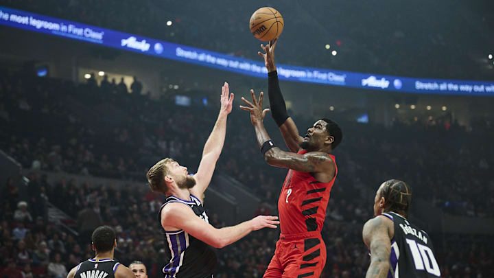 Feb 6, 2025; Portland, Oregon, USA;Portland Trail Blazers center Deandre Ayton (2) shoots a jump shot the ball during the first half against Sacramento Kings forward Domantas Sabonis (11) at Moda Center. Mandatory Credit: Troy Wayrynen-Imagn Images Feb 6, 2025; Portland, Oregon, USA;Portland Trail Blazers center Deandre Ayton (2) shoots a jump shot the ball during the first half against Sacramento Kings forward Domantas Sabonis (11) at Moda Center. Mandatory Credit: Troy Wayrynen-Imagn Images