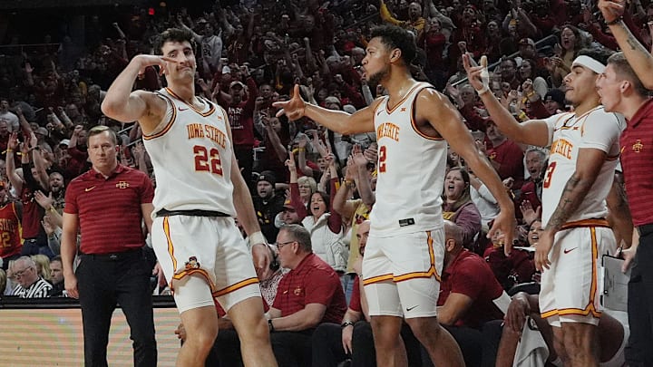 Iowa State forward Milan Momcilovic (22) celebrates with teammates after making a 3-point shot at Hilton Coliseum in Ames on Feb. 8, 2025.