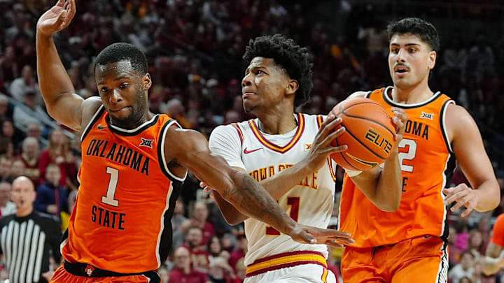 Iowa State Cyclones guard Dominick Nelson (11) drives with the ball to the basket between Oklahoma State Cowboys guard Kanye Clary (1) and forward Parsa Fallah (22)during the first half in the Big-12 men’s basketball on Jan. 10, 2026, at Hilton Coliseum in Ames, Iowa.