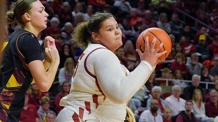 Iowa State Cyclones' center Audi Crooks (55) drives to the basket around Arizona State Sun Devils center Martina Fantini (7) during the second quarter in the Big-12 women’s basketball at Hilton Coliseum on Feb. 18, 2026, in Ames, Iowa