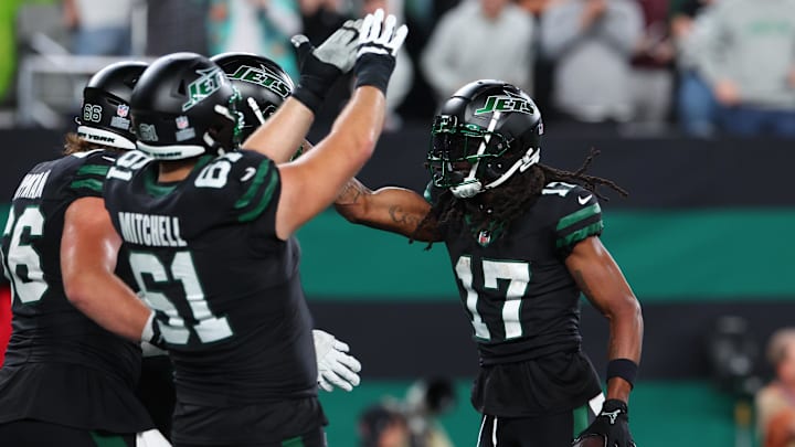 Oct 31, 2024; East Rutherford, New Jersey, USA; New York Jets wide receiver Davante Adams (17) celebrates his touchdown against the Houston Texans during the second half at MetLife Stadium.