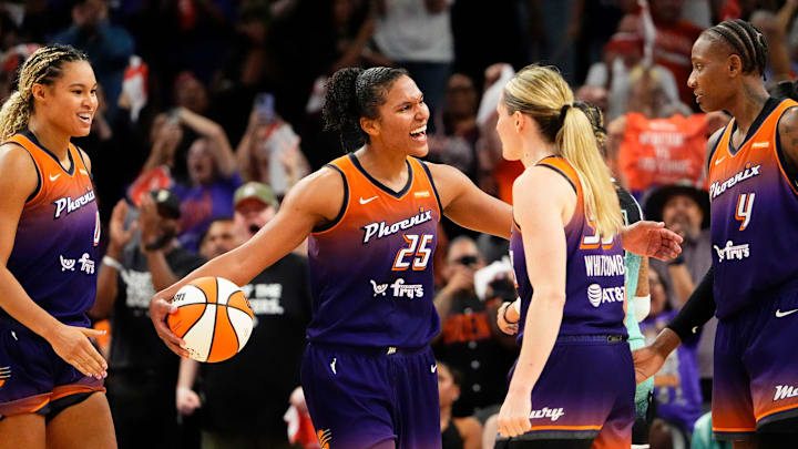 Phoenix Mercury forward Alyssa Thomas (25) celebrates with her teammates as they defeat the New York Liberty 79-73 to win the series during Game Three of the 2025 WNBA Playoffs first round at PHX Arena on Sept. 19, 2025, in Phoenix.