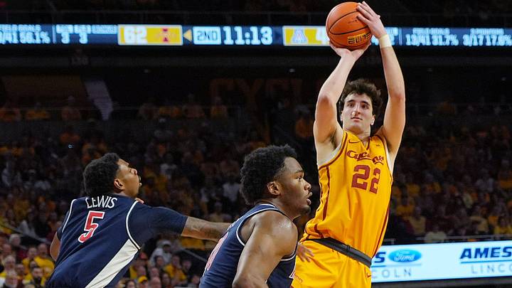 Iowa State Cyclones forward Milan Momcilovic (22) shoots the ball around Arizona Wildcats guard KJ Lewis (5) during the second half in the Big-12 men’s basketball showdown at Hilton Coliseum on Saturday March 1, 2025 in Ames, Iowa. Iowa State Cyclones forward Milan Momcilovic (22) shoots the ball around Arizona Wildcats guard KJ Lewis (5) during the second half in the Big-12 men’s basketball showdown at Hilton Coliseum on Saturday March 1, 2025 in Ames, Iowa.