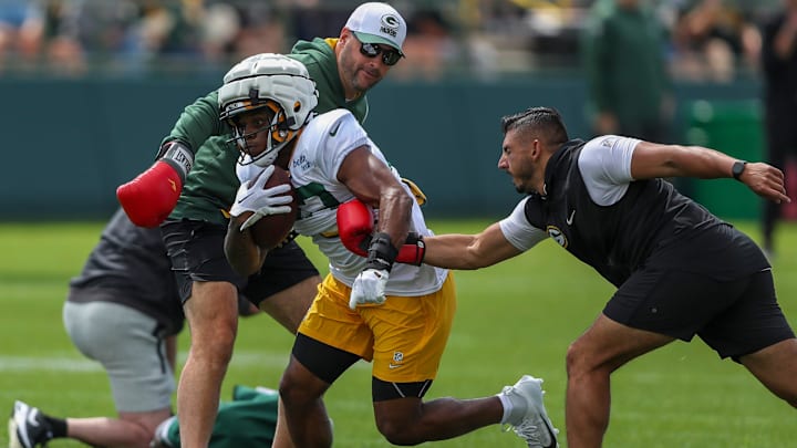 Gren Bay Packers running back MarShawn Lloyd (32) runs through a drill during the 11th practice of training camp on Tuesday, August 6, 2024, at Ray Nitschke Field in Ashwaubenon, Wis. 
Tork Mason/USA TODAY NETWORK-Wisconsin