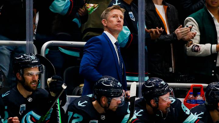 Apr 20, 2022; Seattle, Washington, USA; Seattle Kraken head coach Dave Hakstol stands behind the bench during the third period against the Colorado Avalanche at Climate Pledge Arena. Mandatory Credit: Joe Nicholson-USA TODAY Sports Apr 20, 2022; Seattle, Washington, USA; Seattle Kraken head coach Dave Hakstol stands behind the bench during the third period against the Colorado Avalanche at Climate Pledge Arena. Mandatory Credit: Joe Nicholson-USA TODAY Sports