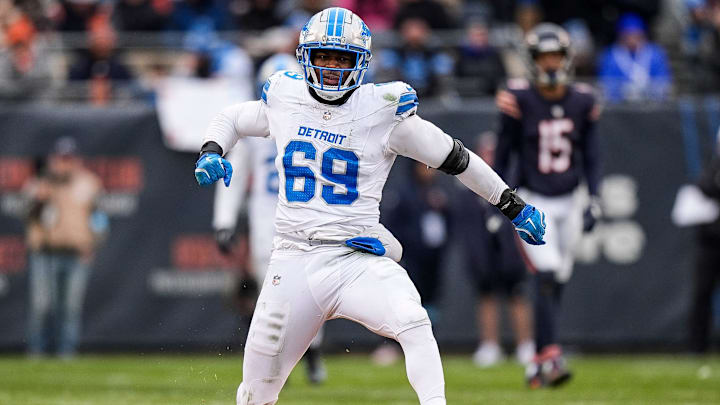 Detroit Lions linebacker Al-Quadin Muhammad (69) celebrates a sack against Chicago Bears quarterback Caleb Williams (18) during the second half at Soldier Field in Chicago, Ill. on Sunday, Dec. 22, 2024. Detroit Lions linebacker Al-Quadin Muhammad (69) celebrates a sack against Chicago Bears quarterback Caleb Williams (18) during the second half at Soldier Field in Chicago, Ill. on Sunday, Dec. 22, 2024.