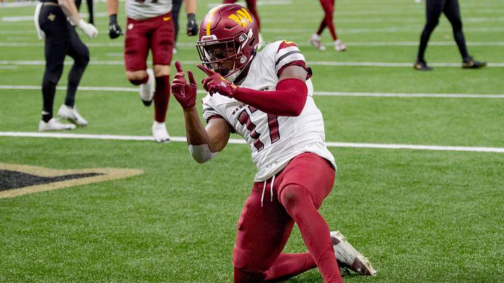Dec 15, 2024; New Orleans, Louisiana, USA;  Washington Commanders wide receiver Terry McLaurin (17) celebrates a touchdown against the New Orleans Saints cornerback Kool-Aid McKinstry (14) during the first half at Caesars Superdome. Mandatory Credit: Matthew Hinton-Imagn Images