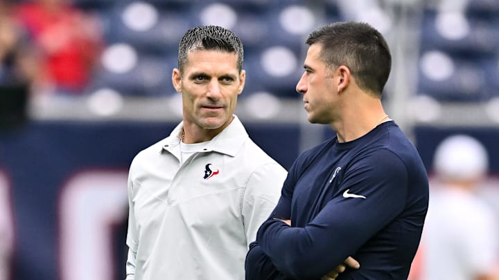 Sep 17, 2023; Houston, Texas, USA; Houston Texans general manager Nick Caserio (left) speaks with special teams coordinator Frank Ross (right) prior to the game against the Indianapolis Colts at NRG Stadium. Mandatory Credit: Maria Lysaker-Imagn Images