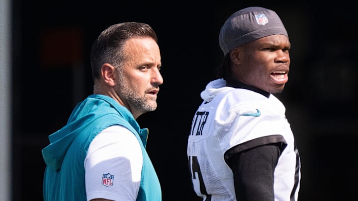 Jacksonville Jaguars Defensive Coordinator Anthony Campanile, left, walks off the field with Jacksonville Jaguars wide receiver Travis Hunter (12) after the Jacksonville Jaguars’ 18th and final training camp practice at Miller Electric Center in Jacksonville, Fla. Wednesday August 20, 2025. [Doug Engle/Florida Times-Union]