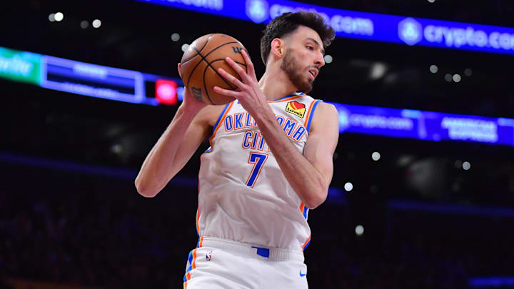 Mar 4, 2024; Los Angeles, California, USA;  Oklahoma City Thunder forward Chet Holmgren (7) gets the rebound against the against the Los Angeles Lakers during the first half at Crypto.com Arena. Mandatory Credit: Gary A. Vasquez-Imagn Images