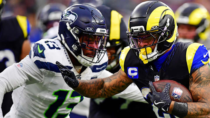 Nov 16, 2025; Inglewood, California, USA; Los Angeles Rams running back Kyren Williams (23) against Seattle Seahawks linebacker Ernest Jones IV (13) during the second half at SoFi Stadium.