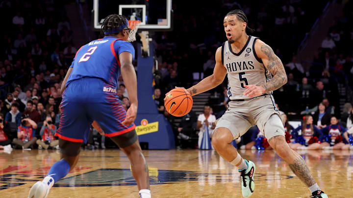 Mar 12, 2025; New York, NY, USA; Georgetown Hoyas guard Micah Peavy (5) controls the ball against DePaul Blue Demons guard Layden Blocker (2) during the second half at Madison Square Garden. Mandatory Credit: Brad Penner-Imagn Images