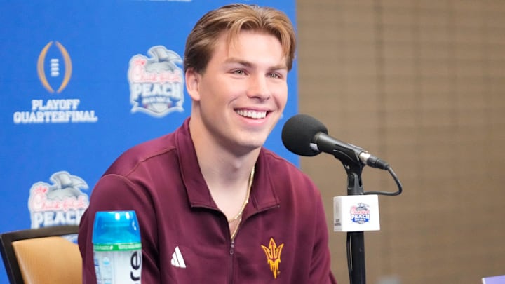 Arizona State quarterback Sam Leavitt smiles after a question during media day for the Chick-fil-A Peach Bowl in Atlanta on Monday, Dec. 30, 2024.