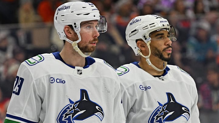 Dec 22, 2025; Philadelphia, Pennsylvania, USA; Vancouver Canucks defenseman Marcus Pettersson (29) and left wing Evander Kane (91) against the Philadelphia Flyers at Xfinity Mobile Arena. Mandatory Credit: Eric Hartline-Imagn Images