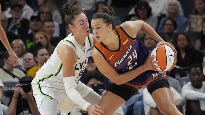 Jul 16, 2025; Minneapolis, Minnesota, USA; Phoenix Mercury forward Kathryn Westbeld (24) works around Minnesota Lynx forward Jessica Shepard (15) in the second quarter at Target Center. Mandatory Credit: Bruce Kluckhohn-Imagn Images