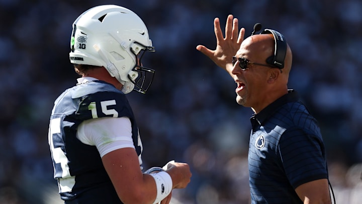 Penn State Nittany Lions head coach James Franklin talks with quarterback Drew Allar (15) Penn State Nittany Lions head coach James Franklin talks with quarterback Drew Allar (15)