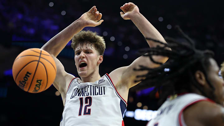 Mar 22, 2026; Philadelphia, PA, USA; UConn Huskies center Eric Reibe (12) dunks the ball against the UCLA Bruins in the first half during a second round game of the men's 2026 NCAA Tournament at Xfinity Mobile Arena. Mandatory Credit: Bill Streicher-Imagn Images Mar 22, 2026; Philadelphia, PA, USA; UConn Huskies center Eric Reibe (12) dunks the ball against the UCLA Bruins in the first half during a second round game of the men's 2026 NCAA Tournament at Xfinity Mobile Arena. Mandatory Credit: Bill Streicher-Imagn Images