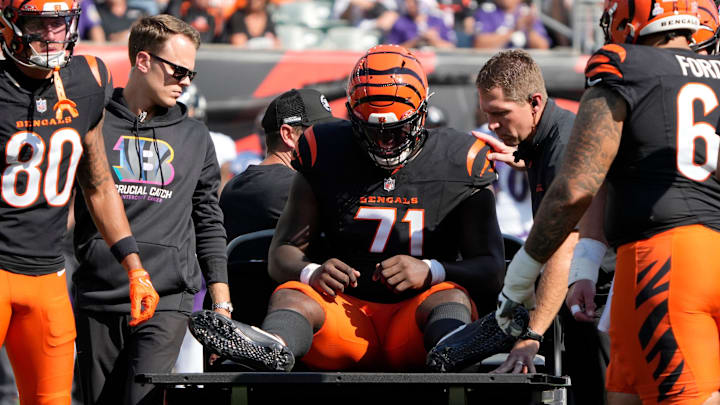 Cincinnati Bengals offensive tackle Amarius Mims (71) is carted off the field in the 3rd quarter against the Baltimore Ravens during NFL Week 5 Sunday October 6, 2024 at Payor Stadium.