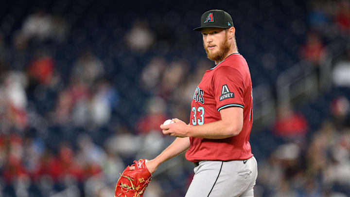 Apr 4, 2025; Washington, District of Columbia, USA; Arizona Diamondbacks pitcher A.J. Puk (33) looks on during the eighth inning against the Washington Nationals at Nationals Park. Mandatory Credit: Reggie Hildred-Imagn Images
