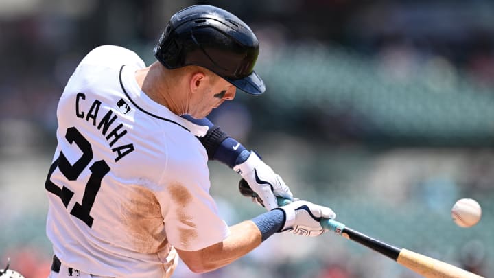 Jun 13, 2024; Detroit, Michigan, USA;  Detroit Tigers first baseman Mark Canha (21) hits an RBI single against the Washington Nationals in the third inning at Comerica Park