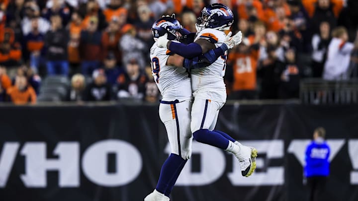 Dec 28, 2024; Cincinnati, Ohio, USA; Denver Broncos defensive end Zach Allen (99) celebrates after a play with defensive tackle Malcolm Roach (97) in overtime against the Cincinnati Bengals at Paycor Stadium. Dec 28, 2024; Cincinnati, Ohio, USA; Denver Broncos defensive end Zach Allen (99) celebrates after a play with defensive tackle Malcolm Roach (97) in overtime against the Cincinnati Bengals at Paycor Stadium.
