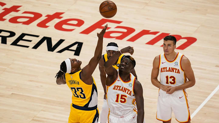 Apr 18, 2021; Atlanta, Georgia, USA; Atlanta Hawks center Clint Capela (15) and Indiana Pacers center Myles Turner (33) battle for the opening tip off during the first quarter at State Farm Arena. Mandatory Credit: Dale Zanine-Imagn Images Apr 18, 2021; Atlanta, Georgia, USA; Atlanta Hawks center Clint Capela (15) and Indiana Pacers center Myles Turner (33) battle for the opening tip off during the first quarter at State Farm Arena. Mandatory Credit: Dale Zanine-Imagn Images