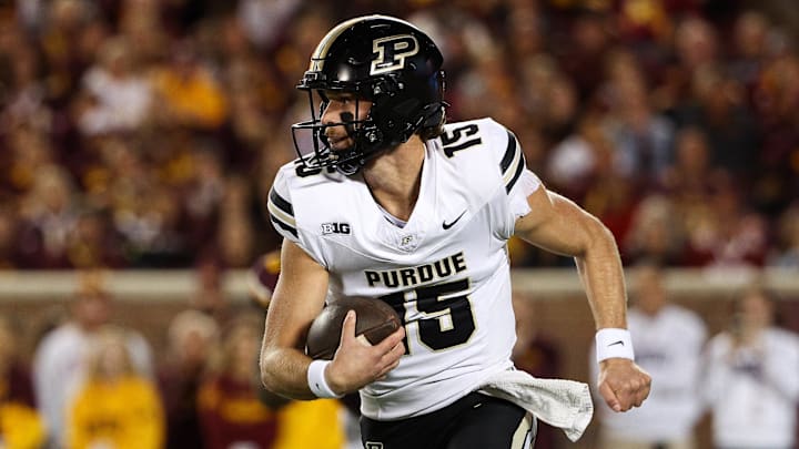 Purdue Boilermakers quarterback Ryan Browne (15) runs the ball 