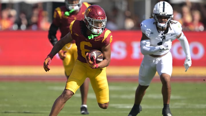 Oct 12, 2024; Los Angeles, California, USA; USC Trojans wide receiver Makai Lemon (6) carries the ball for a first down in the second half against the Penn State Nittany Lions at United Airlines Field at the Los Angeles Memorial Coliseum. Mandatory Credit: Jayne Kamin-Oncea-Imagn Images Oct 12, 2024; Los Angeles, California, USA; USC Trojans wide receiver Makai Lemon (6) carries the ball for a first down in the second half against the Penn State Nittany Lions at United Airlines Field at the Los Angeles Memorial Coliseum. Mandatory Credit: Jayne Kamin-Oncea-Imagn Images