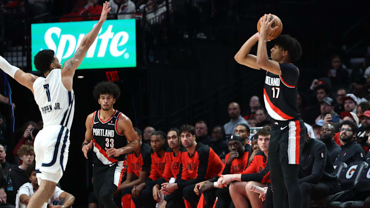 Nov 10, 2024; Portland, Oregon, USA: Portland Trail Blazers guard Shaedon Sharpe (17) shoots the ball over Memphis Grizzlies guard Scotty Pippen Jr. (1) as Trail Blazers’ forward Toumani Camara (33) watches in the second half at Moda Center. Mandatory Credit: Jaime Valdez-Imagn Images Nov 10, 2024; Portland, Oregon, USA: Portland Trail Blazers guard Shaedon Sharpe (17) shoots the ball over Memphis Grizzlies guard Scotty Pippen Jr. (1) as Trail Blazers’ forward Toumani Camara (33) watches in the second half at Moda Center. Mandatory Credit: Jaime Valdez-Imagn Images