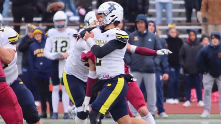 Xaverian Brothers quarterback Will Wood throws a pass during a game against BC High at Rocky Marciano Stadium. 
