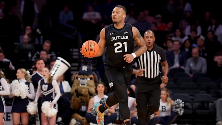 Mar 12, 2025; New York, NY, USA; Butler Bulldogs forward Pierre Brooks II (21) brings the ball up court against the Providence Friars during the first half at Madison Square Garden. Mandatory Credit: Brad Penner-Imagn Images