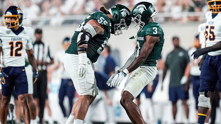 Michigan State cornerback Tre Bell (3), right, celebrates a tackle against Toledo with defensive lineman Ben Roberts (55) during the first half at Spartan Stadium in East Lansing on Friday, Sept. 4, 2026.