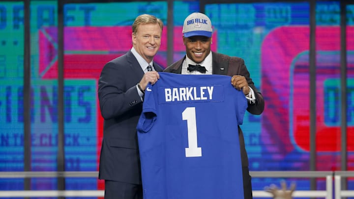 Apr 26, 2018; Arlington, TX, USA; Saquon Barkley (Penn State) poses with NFL commissioner Roger Goodell after being selected as the number two overall pick to the New York Giants in the first round of the 2018 NFL Draft at AT&T Stadium.  